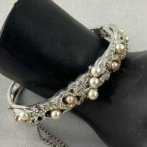 Silver tone clamp bracelet with pearls and rhinestones